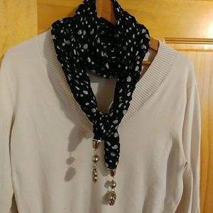 Black and white polka dot scarf with metal flower